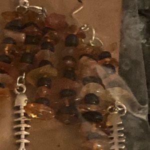 Orange and black dead fish skeleton earrings for Halloween